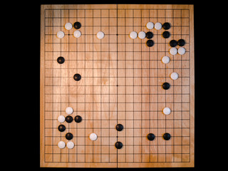 top view of Go game(Weiqi),Traditional asian strategy board game on black background