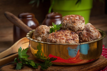 Fried pork chops in the pan.