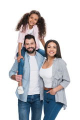 Obraz premium Happy multiethnic family smiling at camera isolated on white
