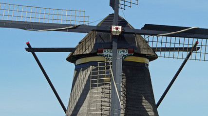 Row of mills in Kinderdijk, Netherlands. This cover nineteen mills in the northwest of the Alblasserwaard, in the Green Heart of Holland. Since 1997 they have been on UNESCO World Heritage List.