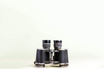 Binoculars isolated on yellow background