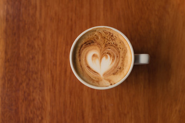 Coffee cappuccino on wood table.
