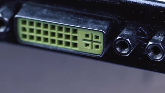 Macro shot of technology background. Graphics card back with standard DVI ports rotating. Shallow depth of field.