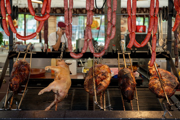 Street food in San Fermin feast, Pamlona, Navarra, Spain. Pork. Grilled meat and sausage. Spanish traditional cuisine. Spanish national dish. image toned and noise added.