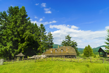 Fototapeta premium Old wooden ruin house in the mountains of Fagaras Mountains in Romania