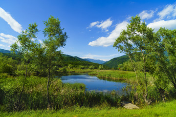 Fototapeta na wymiar A small mountain lake in the mountains of Fagaras, Romania