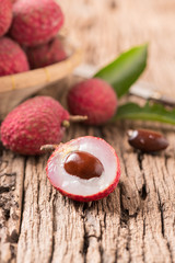 fresh organic lychee fruit on wood
