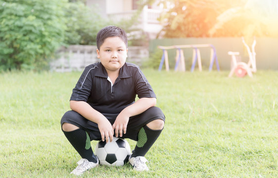 Obese Fat Boy Soccer Player Sit On Football