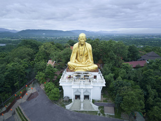 Aerial view, Kruba Srivichai statue at Wat Doi Ti  the old history temple in Lumphun, Thailand.