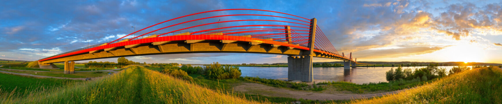 Fototapeta Cable stayed bridge over Vistula river in Poland at sunset