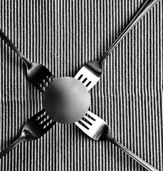 Egg balanced on forks
