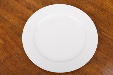 Empty White Plate on Wood Table