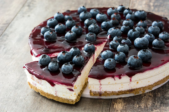 Blueberry cheesecake on wooden table

