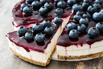 Blueberry cheesecake on wooden table
