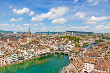 Fototapeta na wymiar Zurich inner city / downtown, St. Peter church and town hall - aerial view towards bridge Rathausbrucke
