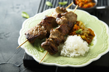 Meat skewers with hot chili sauce