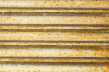 Close-up of old yellow rusty metal blind