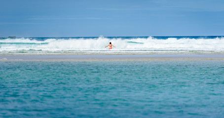 Woman enjoying the sea and waves of Atlantic ocean.
