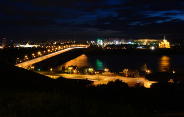 Fototapeta na wymiar Night view of Nizhny Novgorod, Oka river and Alexander Nevsky Cathedral