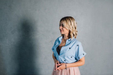 Happy young woman in casual clothes, smiling