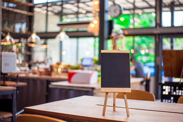 Black label on the table. Stand for acrylic tent card Used for Menu Bar and restaurant or put everything into it . mockup