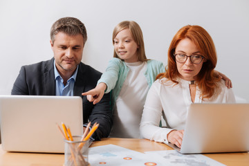 Open minded lovely girl asking things about parents project