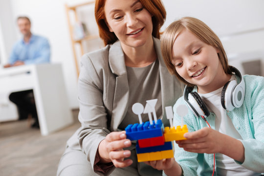 Sweet Girl And Her Mom Combining Puzzles Of Construction Set