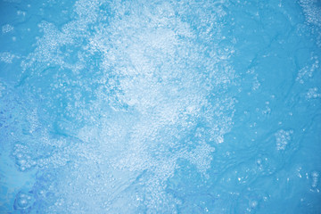 Blue clear fresh Water in jacuzzi. Spa massage background.