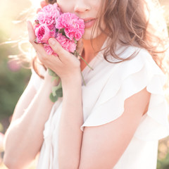 Woman holding roses closeup. Summer season. Selective focus.