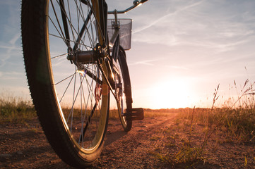 Fototapeta na wymiar bike on the bandwagon on the road during sunset,