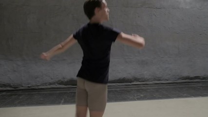 Dancing man modern ballet dancer performs dance in studio 60 fps slow motion