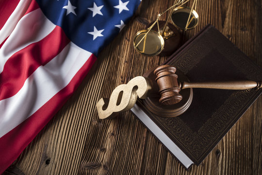 Gavel on the Bible. American flag on wooden table. Independence Day. 4 th of July.