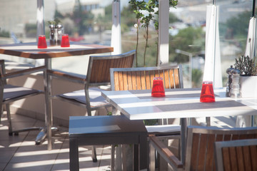 Roof garden restaurant tables with sunglight