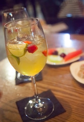 White sangria wine glass on wooden table