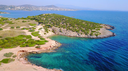 Aerial drone photo of Hamolia area with turquoise colored clear water rocky beaches, Porto Rafti,...