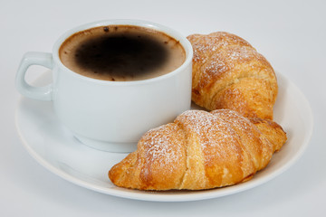 Lush croissants with fragrant coffee for breakfast