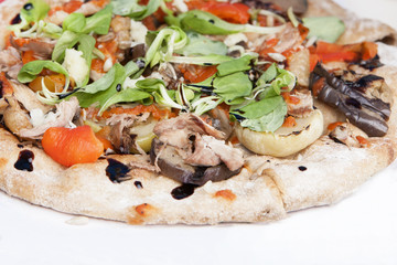 Fresh italian pizza with mushrooms, ham, tomatoes, cheese on light white background.