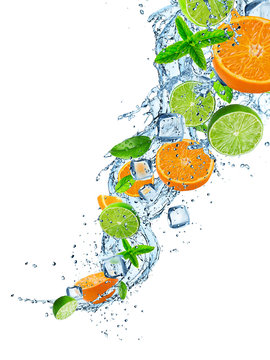 Fresh limes and oranges with water splash on white.