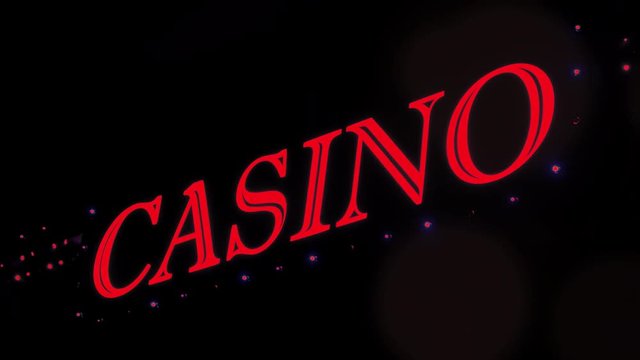 Red casino sign with flashing lights at entrance to casino glows in the dark.