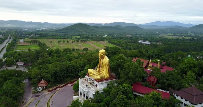 Aerial view, Kruba Srivichai statue at Wat Doi Ti  the old history temple in Lumphun, Thailand.