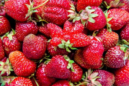 Background of ripe strawberry strawberries shot close-up