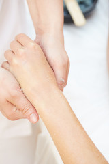 Fototapeta premium Woman Getting a Salt Scrub Beauty Treatment on hands in the Health Spa