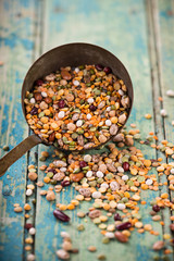 Raw legume on old rustic wooden table.