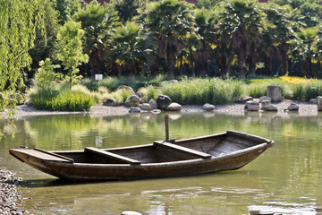 Wooden boat on lake side