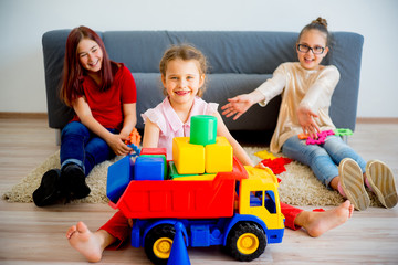 Girl playing with toy truck