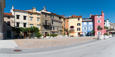 Fototapeta na wymiar Panoramic view of some old houses on a small square in the picturesque town of Piran in Slovenia