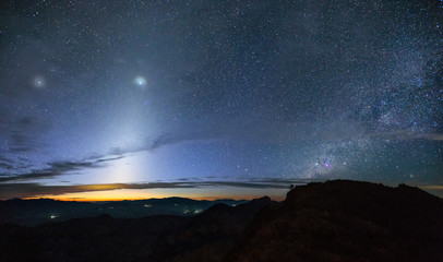 Zodiacal Light and the milky way over the mountain at early morning, Thailand