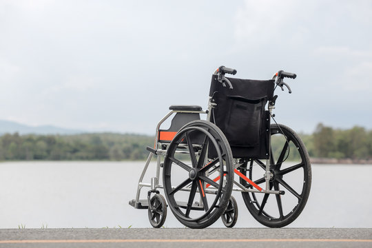 Empty wheelchair on lake