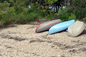 Kayaks on rocky beach 