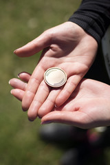 Young woman is holding medal in the hands